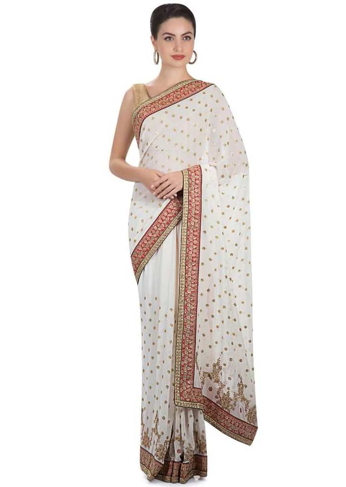 White georgette saree adorned with sequins and zari work only on Kalki