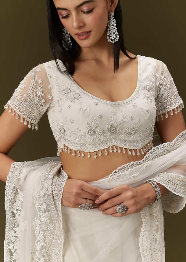 White Net Saree With All Over Embroidery