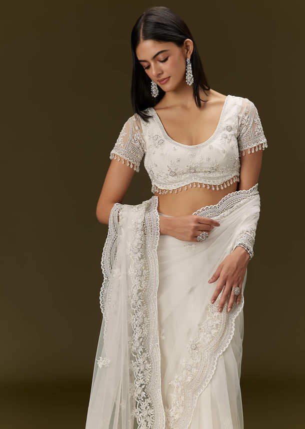 White Net Saree With All Over Embroidery
