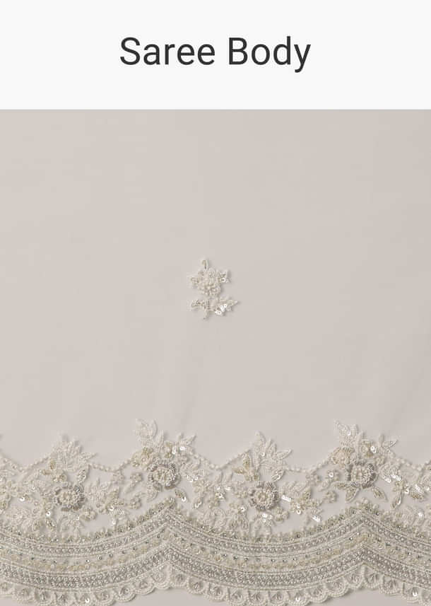 White Net Saree With All Over Embroidery