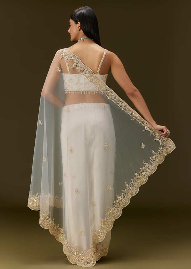 White Net Heavy Embroidered Saree With Embellished Border