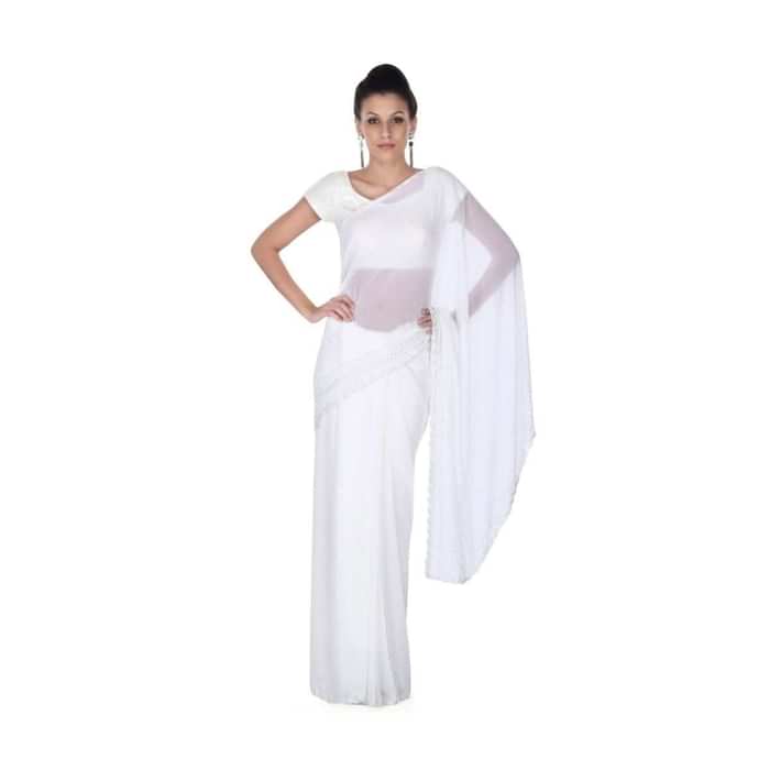White saree with kundan and kardana adorn border only on Kalki