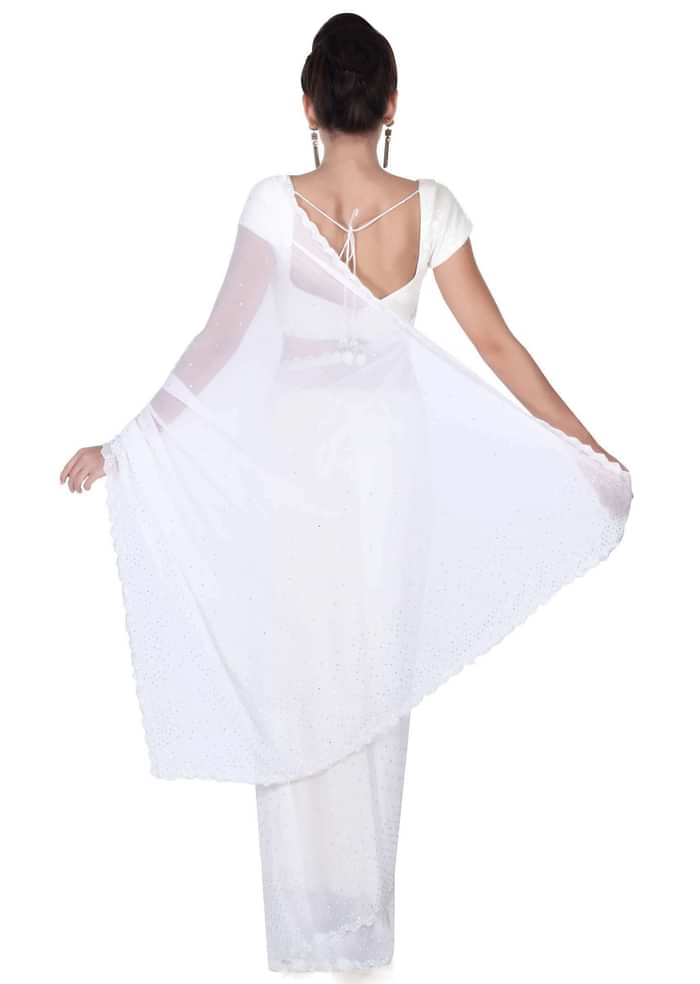 White saree with kundan and kardana adorn border only on Kalki