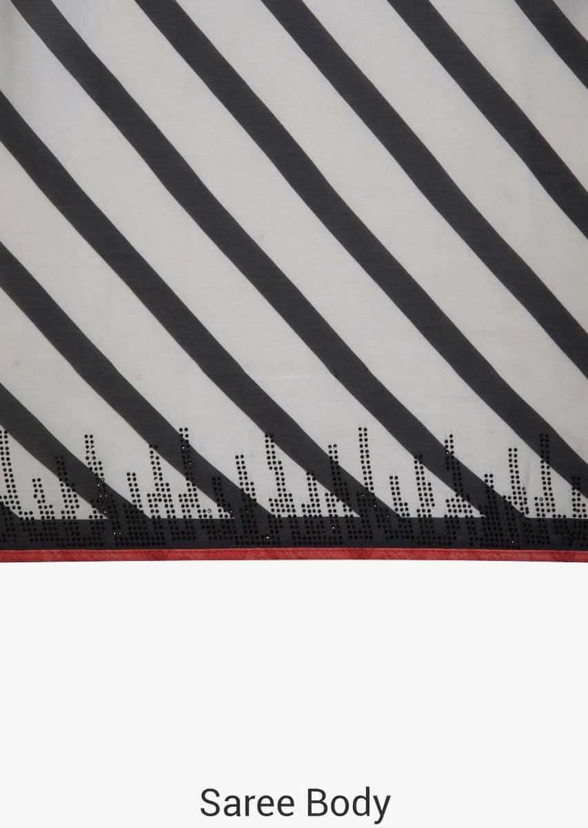 White and black stripe print with black kundan along the border only on  Kalki