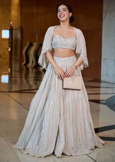 White Ruched Lehenga With Spaghetti Blouse And Cape