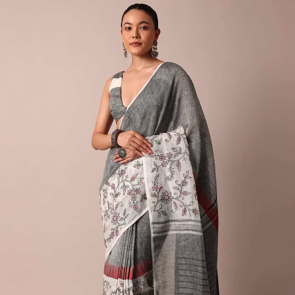 White Woven Cotton Linen Embroidered Saree With Floral Motifs And Unstitched Blouse Piece