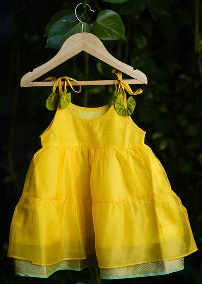 Kalki Girls Yellow Tiered Dress In Cotton Silk With Adjustable Green Tie Ups On The Shoulder By Love The World Today