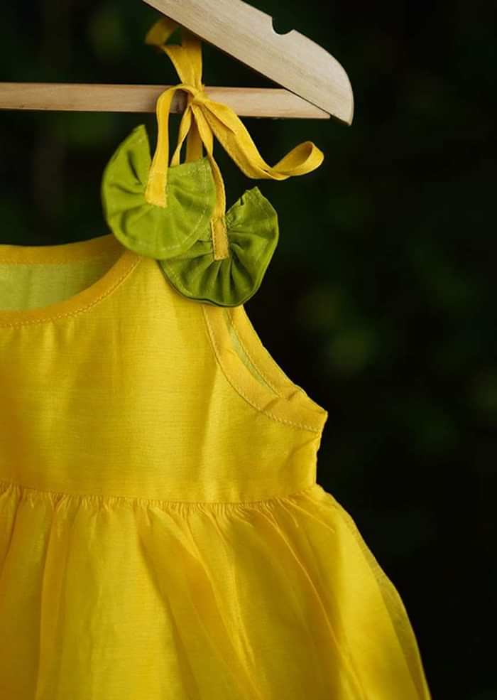 Kalki Girls Yellow Tiered Dress In Cotton Silk With Adjustable Green Tie Ups On The Shoulder By Love The World Today