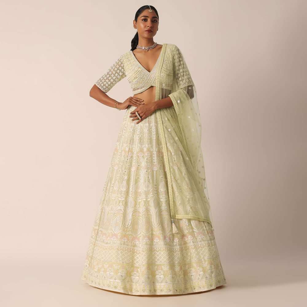 Yellow Net Embroidered Blouse And Skirt Set