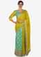 Yellow saree in cotton with ready stitched blouse embellished in zari butti embroidery only on Kalki