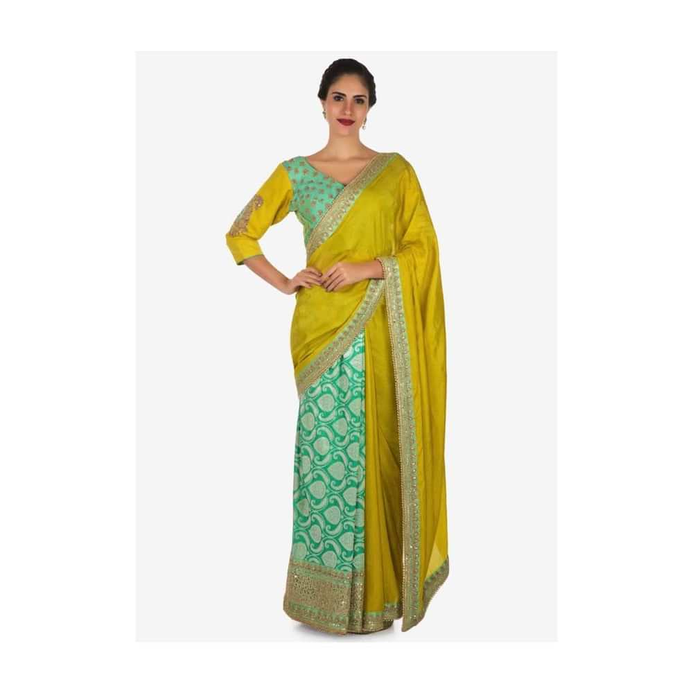 Yellow saree in cotton with ready stitched blouse embellished in zari butti embroidery only on Kalki