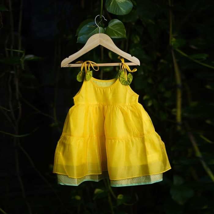 Kalki Girls Yellow Tiered Dress In Cotton Silk With Adjustable Green Tie Ups On The Shoulder By Love The World Today